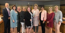 From left: Chief Superintendent Gary Strother, Trustee Pamela Rath, Trustee Cathie Williams, Trustee Linda Wellman, ASCA President Allison Pike, Board Chair Mary Martin, Trustee Myra D’Souza, Trustee Lory Iovinelli, Trustee Cheryl Low